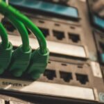 Network cables connected to server ports for cybersecurity infrastructure